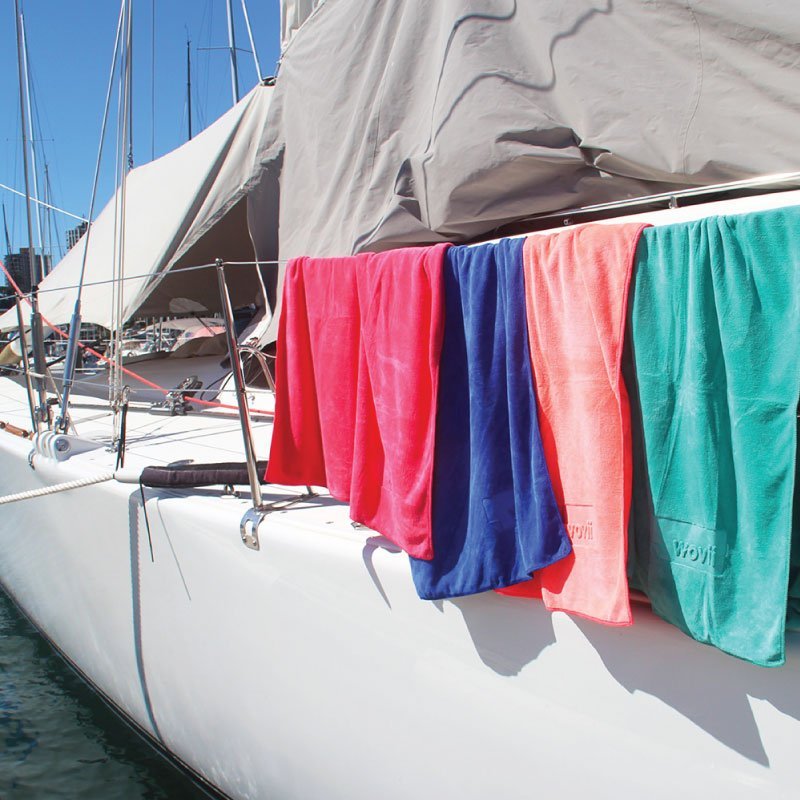 JUMBO Wovii Beach Towel / Bath Sheet hanging off a yacht railing Wovii