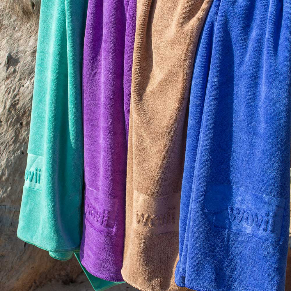 Sand free wovii beach towels hanging side by side