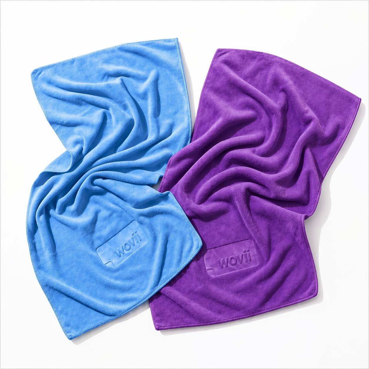 Blue and purple towels with 'Wovii' branding on a white background