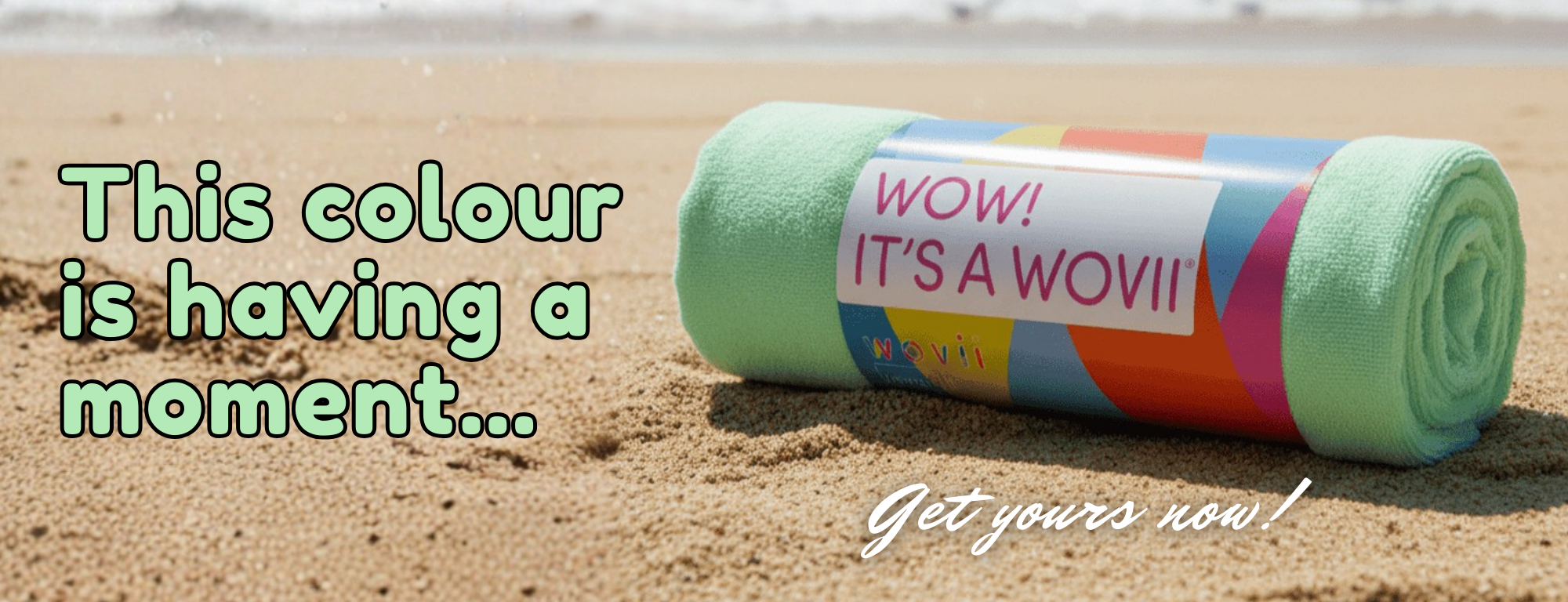 Mint towel on a sandy beach